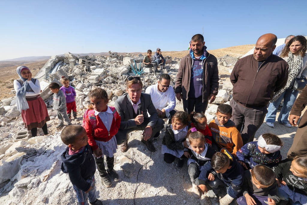 Sven von Burgsdorff, head of the European Union's mission to the West Bank and Gaza, with children at the site of a Palestinian school which was demolished by Israeli authorities in the village of Esfay, in the Masafer Yatta area in the Israeli-occupied West Bank, in December. Photograph: Hazem Bader/Getty Images