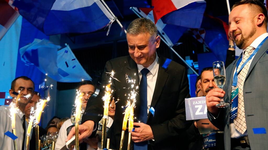 HDZ leader Tomislav Karamarko celebrates the party’s achievement in securing the most seats in Croatia’s general election. The party had expected to win more decisively, however. Photograph: Antonio Bat/EPA