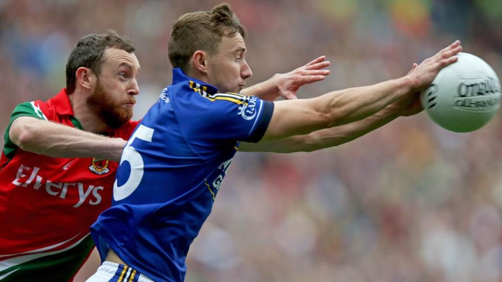 Keith Higgins of Mayo tracks Kerry’s James O’Donoghue at Croke Park last weekend.  Photograph: Donall Farmer / Inpho