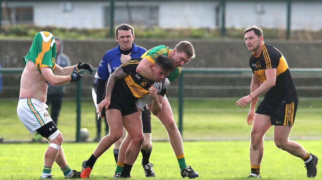 Tempers flair between Clonmel’s Liam Ryan and Micheal Burns of Dr Crokes. Photo: Bryan Keane/Inpho