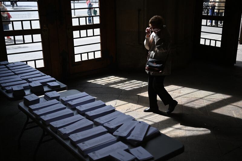 A voter prepares to vote at a polling station in the University of Barcelona. Photograph: Getty Images