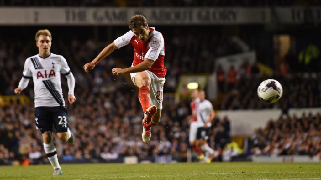 Mathieu Flamini fires a wonder strike into the net to send Arsenal into the next round of the Capital One Cup. Photo: Toby Melville/Reuters