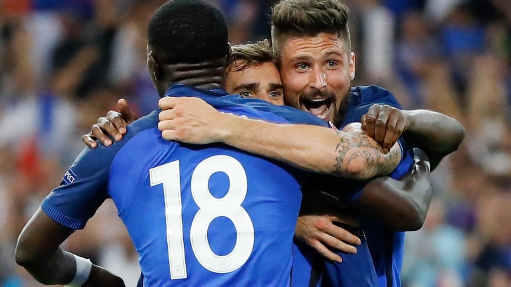 France’s Antoine Griezmann, center, celebrates with his team-mate Olivier Giroud and Moussa Sissoko after scoring his side’s second goal against Germany. Photograph: Frank Augstein/AP Photo