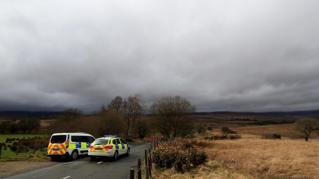 Police man a roadblock in Trawsfynydd, north Wales, where the wreckage  of the Twin Squirrel helicopter was found. Photograph: Peter Byrne/PA Wire