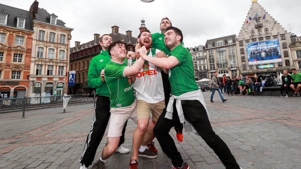 Republic of Ireland fans goof about with a football in the Grand Place in Lille, France, June 21st, 2016. Photograph: James Crombie/Inpho