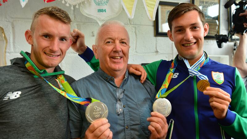 Skibbereen coach Dominic Casey pictured with Olympic silver medallists Gary and Paul O’Donovan. Photograph: Michael Mac Sweeney/Provision