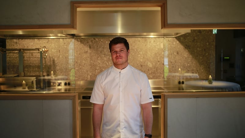 Jordan Bailey at the entrance to the kitchen or “cooking suite”.