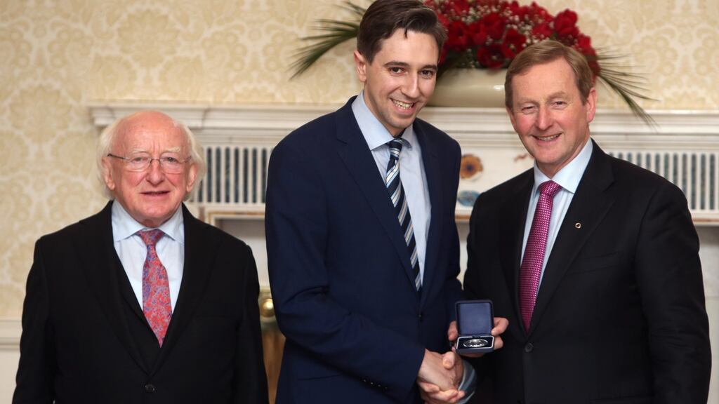 President Michael D Higgins with the new Minister for Health Simon Harris and Taoiseach Enda Kenny at Aras an Uachtarain. Photograph: Brian Lawless/PA Wire