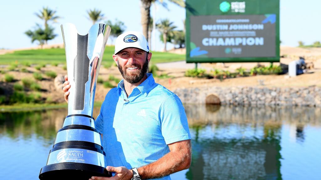 Dustin Johnson with the trophy after his win at the Saudi International at Royal Greens Golf and Country Club in King Abdullah Economic City, Saudi Arabia back in February. Photograph: Ross Kinnaird/Getty Images