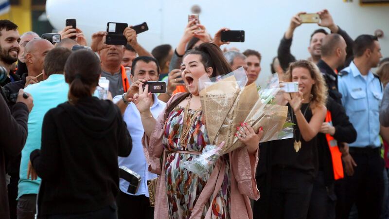 Israel’s Netta Barzilai poses for a photograph as she arrives at Ben Gurion Airport near Tel Aviv on Monday after winning the Eurovision Song Contest. Photograph: Gideon Markowicz/AFP/Getty Images