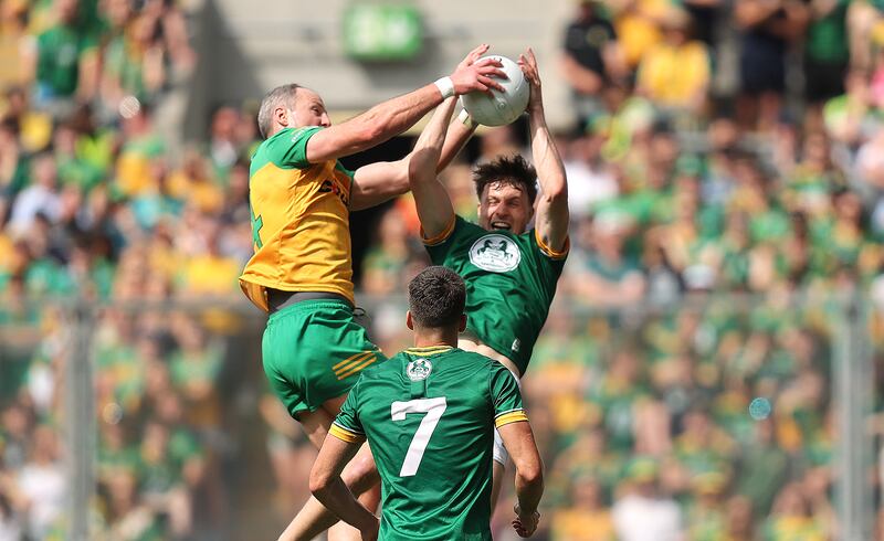 Donegal's Michael Murphy and Adam O’Neill of Meath compete for possession. Photograph: Bryan Keane/Inpho
