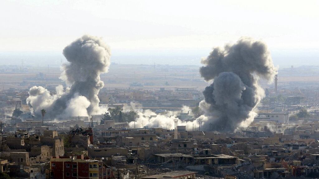 Smoke rises from the site of US-led air strikes in the town of Sinjar, Iraq. Photograph: Ari Jalal/Reuters