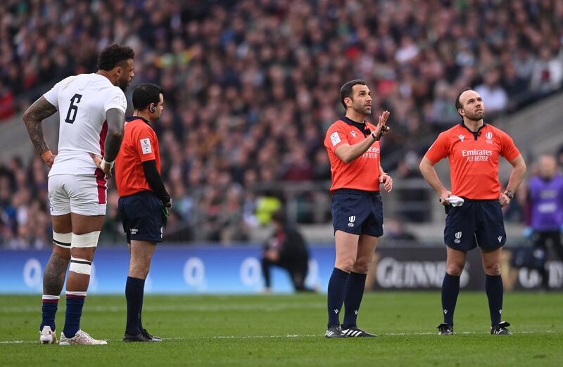 Referee Mathieu Raynal studies the big screen with the TMO before sending off England player Charlie Ewels during the Six Nations game against Ireland at Twickenham. Photograph: Stu Forster/Getty Images