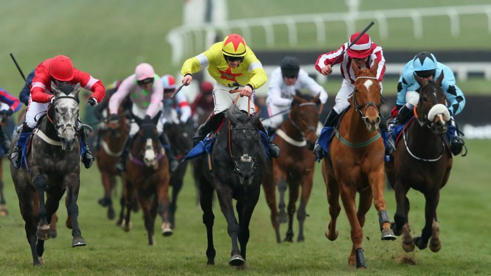 Aux Ptits Soins ridden by Sam Twiston-Davies (yellow) wins the Coral Cup ahead of Zabana. Photograph:  Alex Livesey/Getty Images