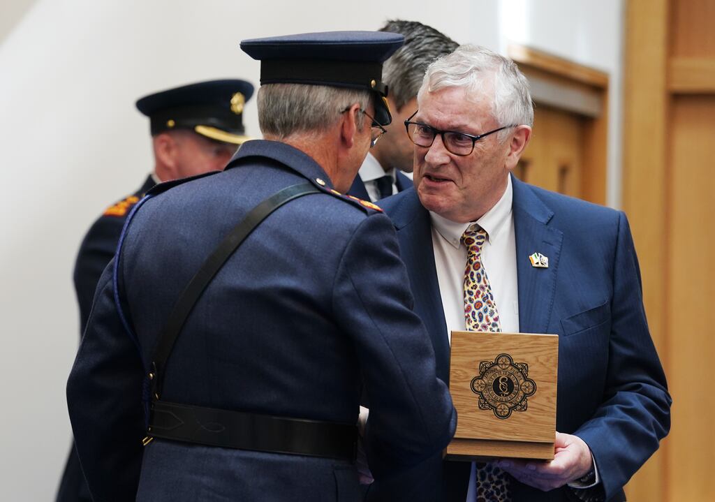 Garda Commissioner Drew Harris with John Donegan, son of late Inspector Sam Donegan who was posthumously awarded the Gold Scott Medal during a ceremony in Dublin on Friday. Photograph: Brian Lawless/PA Wire