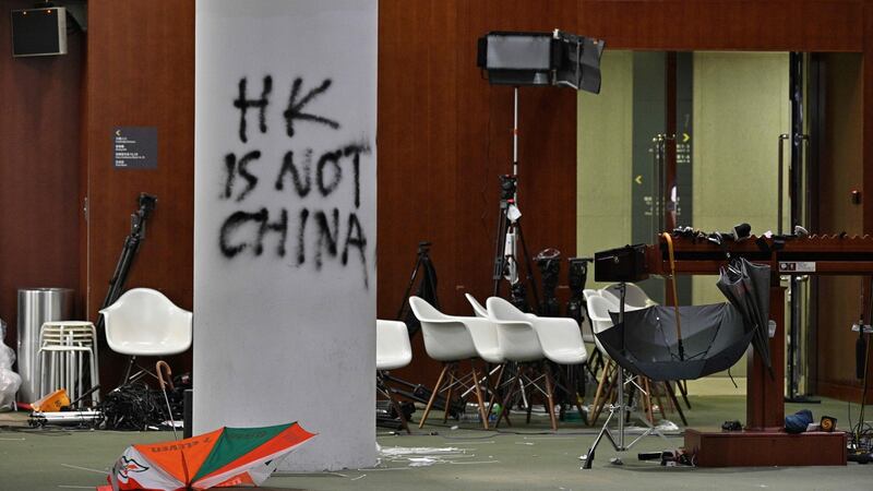 Graffiti and umbrellas outside the main chamber of the Legislative Council, where protestors broke in, in Hong Kong. Photograph:  Anthony Wallace/AFP/Getty Images