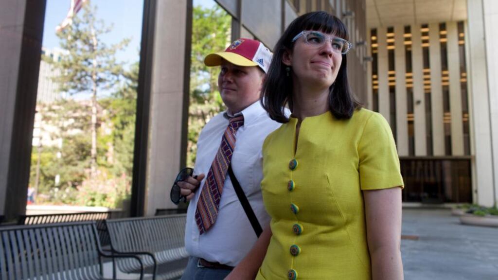 Kate Kelly, the founder of Ordain Women, and her husband, Neil Ransom, outside the offices of the Church of Jesus Christ of Latter-day Saints in Salt Lake City. Photograph: Jim McAuley/The New York Times