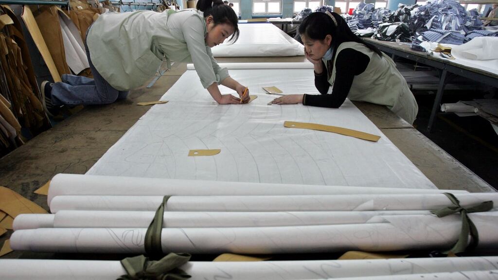 Mongolian women working in the clothing industry. When women are paid, they earn on average 24% less than men