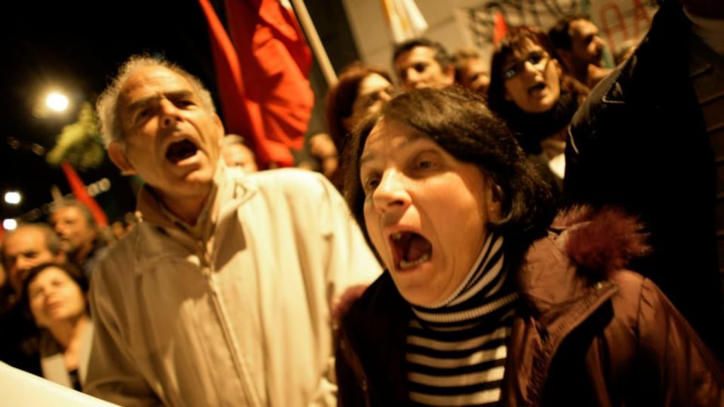 Protestors shouting anti-EU  slogans outside a Eurogroup meeting at the European Council building last night in Nicosia. Photograph: Milos Bicanski/Getty Images