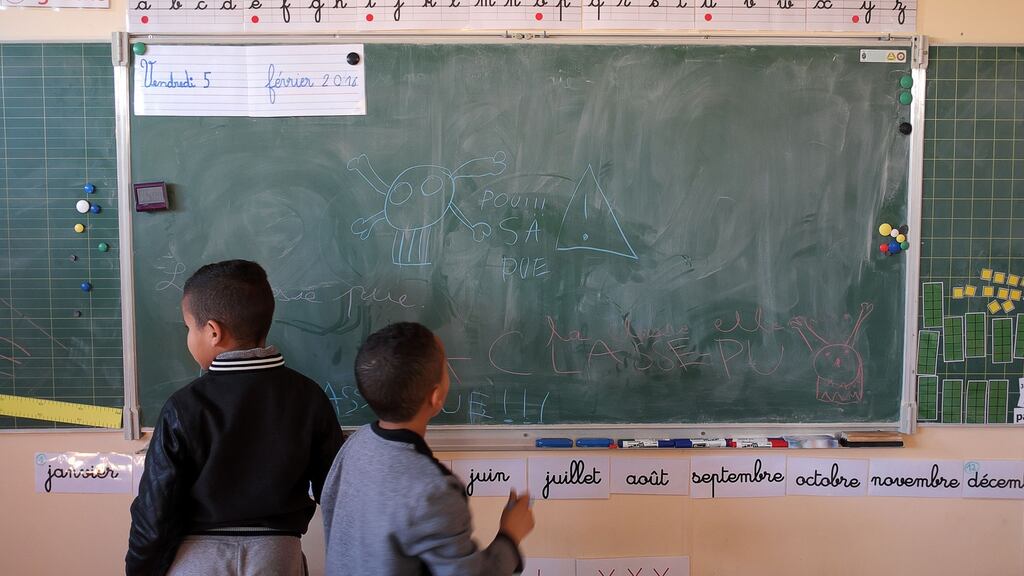 Children write on the blackboard in a Marseille school. File photograph: Boris Horvat/AFP/Getty Images