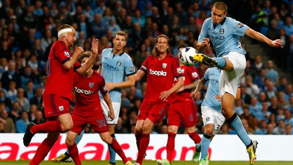 Manchester City’s Jack Rodwell (R) shoots at goal at The Etihad Stadium. Photograph: Darren Staples/Reuters