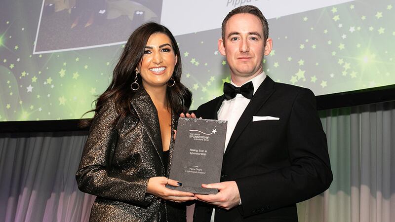 Conor Cullen, Sponsorship and Events Manager, Football Association of Ireland, presents the Rising Star in Sponsorship award to Pippa Doyle, Littlewoods Ireland.