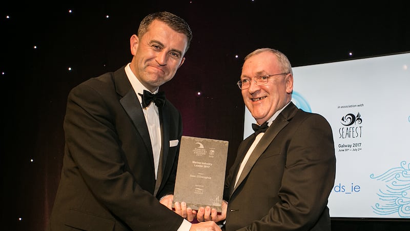Conor Mowlds, Head of National Maritime College of Ireland, NMCI, presents the Marine Industry Leader 2017 award to Sean O’Donoghue