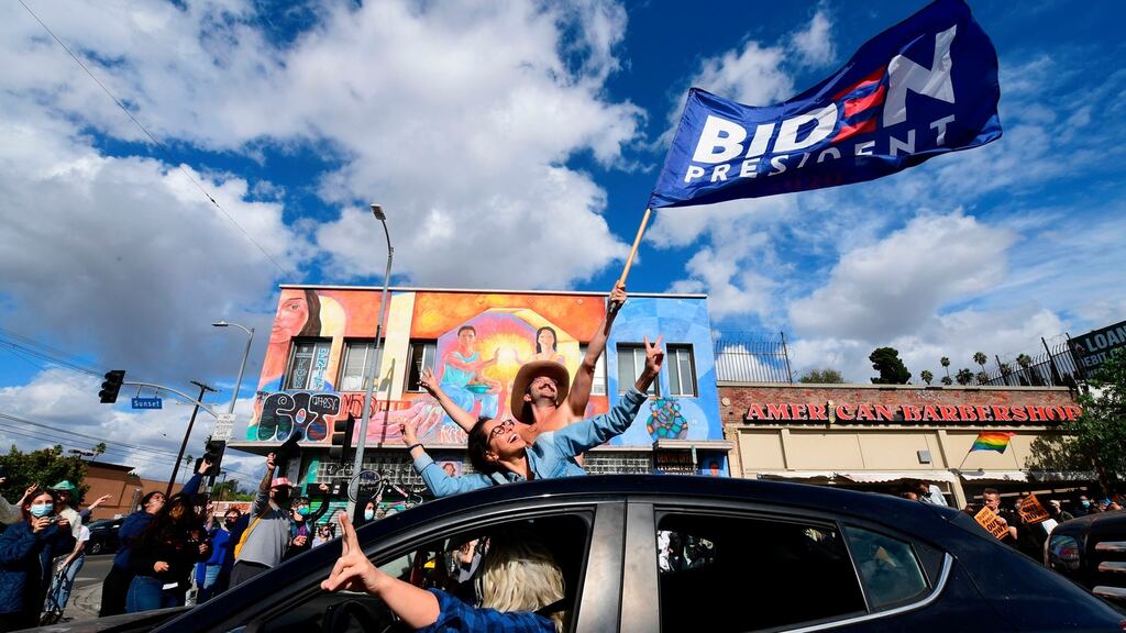 People take to the streets in Los Angeles to celebrate Joe Biden’s victory in the 2020 US presidential election. Photograph: Frederic J Brown/AFP via Getty Images