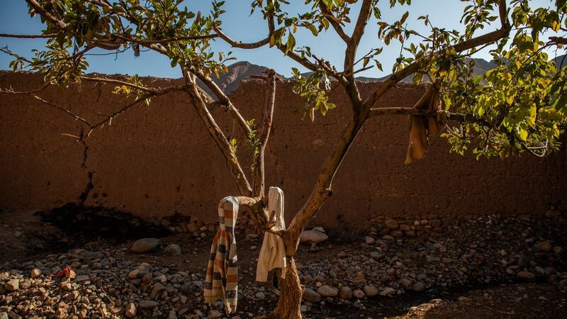 Two hooded sweatshirts kept by Mohammad Bakhsh, the father of two boys who were killed by a Soviet cluster bomb. Photograph: Kiana Hayeri/New York Times