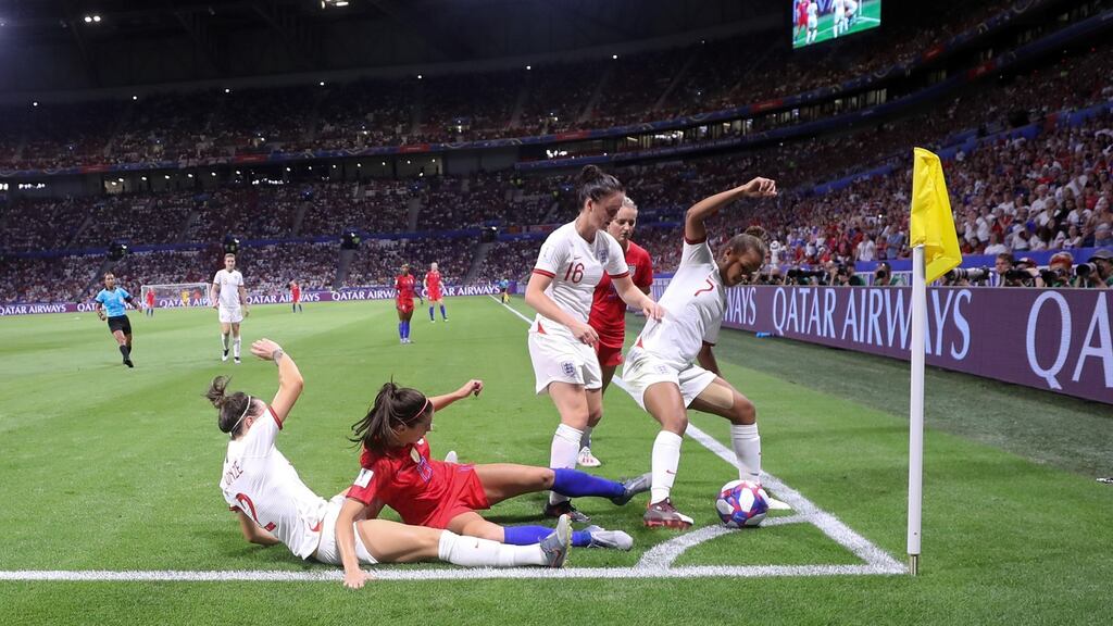 Alex Morgan of the USA is challenged by Lucy Bronze, Jade Moore and Nikita Parris of England during the 2019 Fifa Women’s World Cup semi-final in Lyon. Photo: Alex Grimm/Getty Images