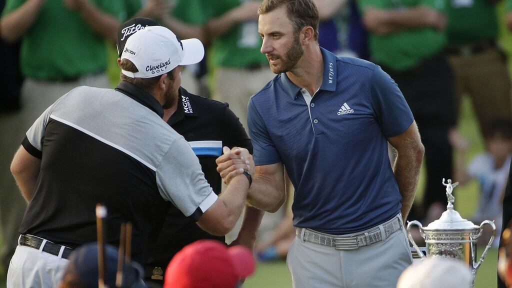 Dustin Johnson shakes hands with Shane Lowry at Oakmont Country Club after the final round on Sunday. Photograph: Gene J. Puskar/PA