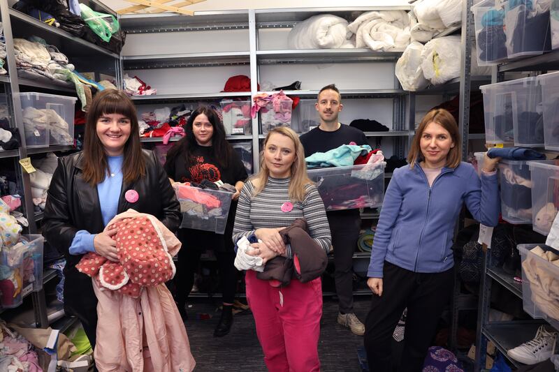 East Wall Here For All volunteers Molly Hennessey, Heather Harte, Roxanna Nic Liam, Jane Dunne and Paddy O’Dea sort through donated items for asylum seekers, housed at the old ESB office block in East Wall, Dublin. Photograph: Dara Mac Dónaill