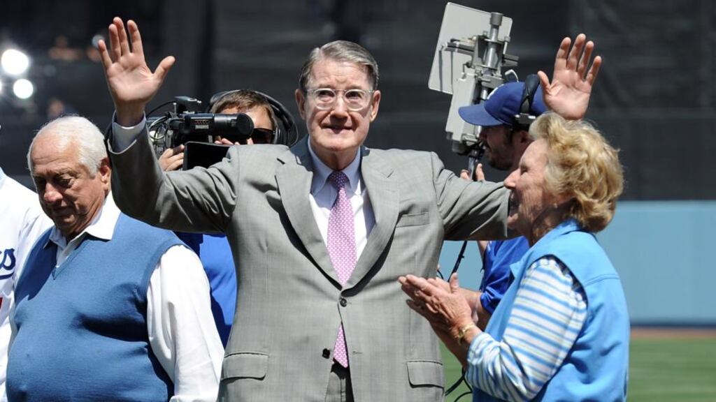 Former Los Angeles Dodgers owner Peter O’Malley watches sister Terry Seidler throw out the ceremonial first pitch to former Dodgers player and manager Tommy Lasorda on opening day at Dodger Stadium 2012. On April 10th, 1962, at Dodger Stadium Peter and Terry’s mother Kay threw out the ceremonial first pitch in the stadium her husband, Walter, built. Photograph: Harry How/Getty Images