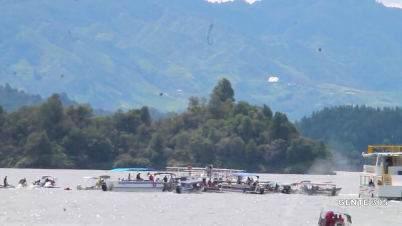Boats go the the rescue of a sinking tourist ferry in the Guatape reservoir in Colombia. Photograph: Reuters