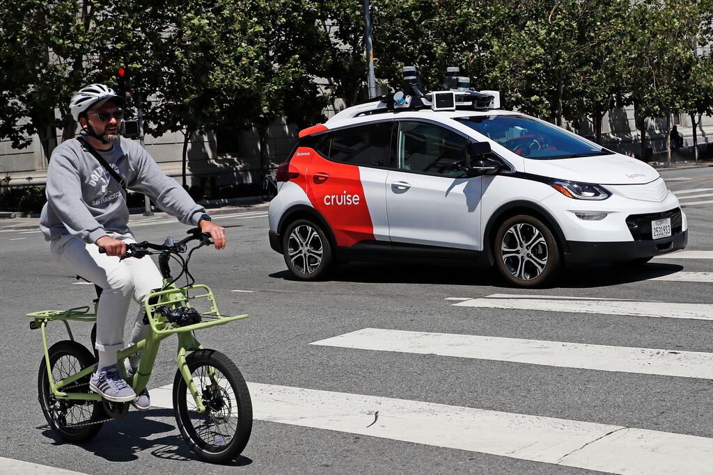 A Cruise robotaxi self-drives on a street in San Francisco. But what's going on behind those darkened backseat windows? Photograph: John G. Mabanglo/EPA