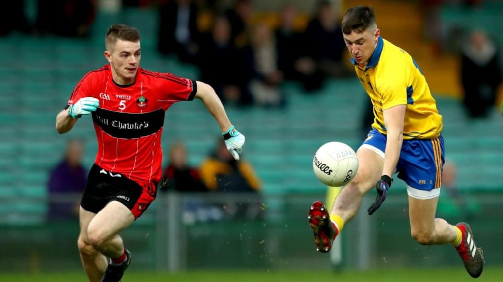 Conor Gleeson of The Nire is chased down by Adare’s Oran Collins during the AIB Munster Club SFC quarter-final at the Gaelic Grounds in Limerick. Photograph: James Crombie/Inpho