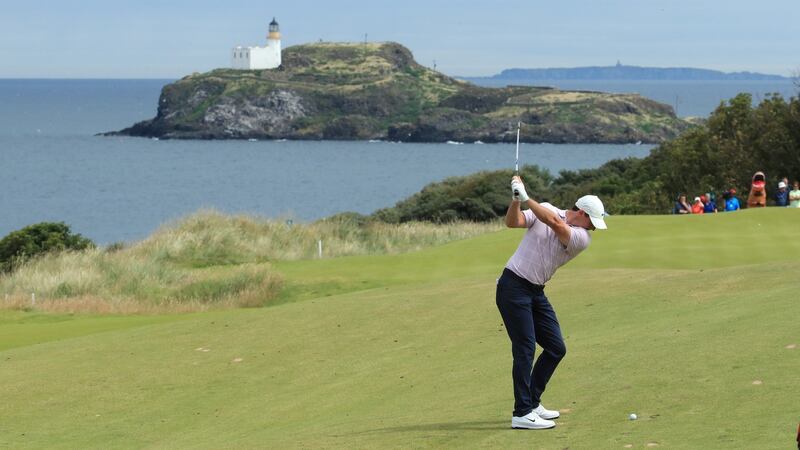 McIlroy hits his second to the fourth. Photo: Andrew Redington/Getty Images