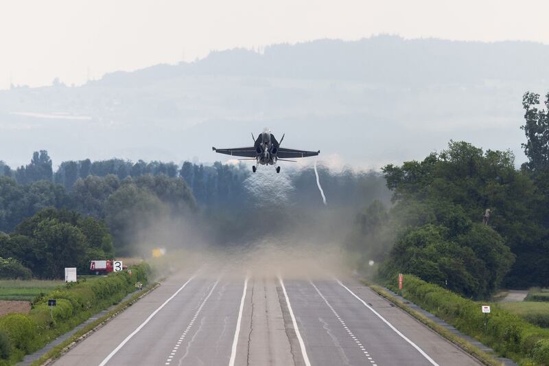 Capt Marcel 'Frodo' Rust lands his F/A-18 Hornet fighter on a motorway north of Geneva. Photograph: VBS/DDPS