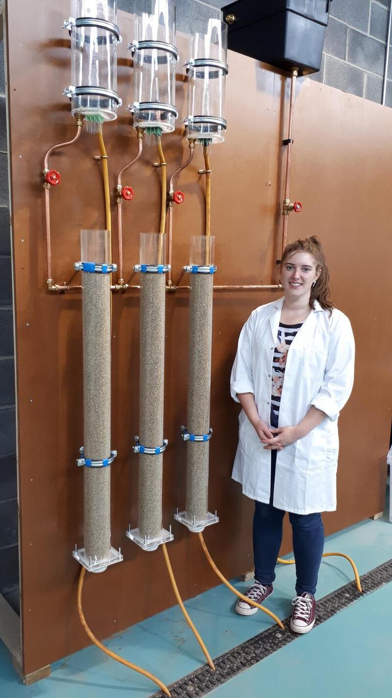 Linday Heerey, a PhD student at UCD, in front of the soil column equipment evaluating microplastics in earth