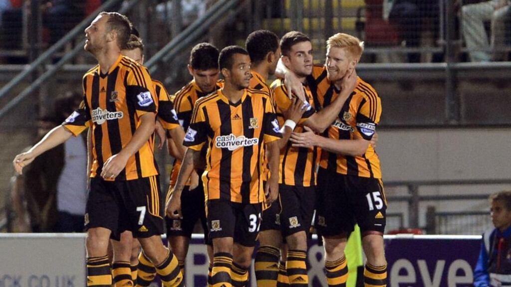 Robbie Brady is congratulated by his Hull and Republic of Ireland team-mate Paul McShane after scoring the winning goal against Leyton Orient in the Capital One Cup second round match at the Matchroom Stadium. Photograph: Anthony Devlin/PA
