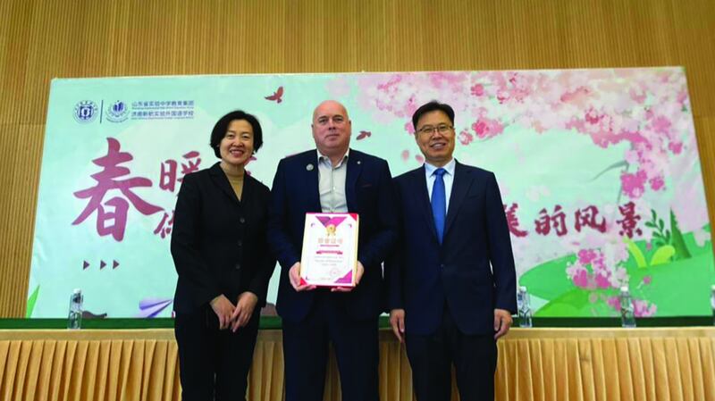 The ‘Teacher of the year Excellence Award for contribution to Student and Campus life’ is presented to Declan Roche by the director and principal