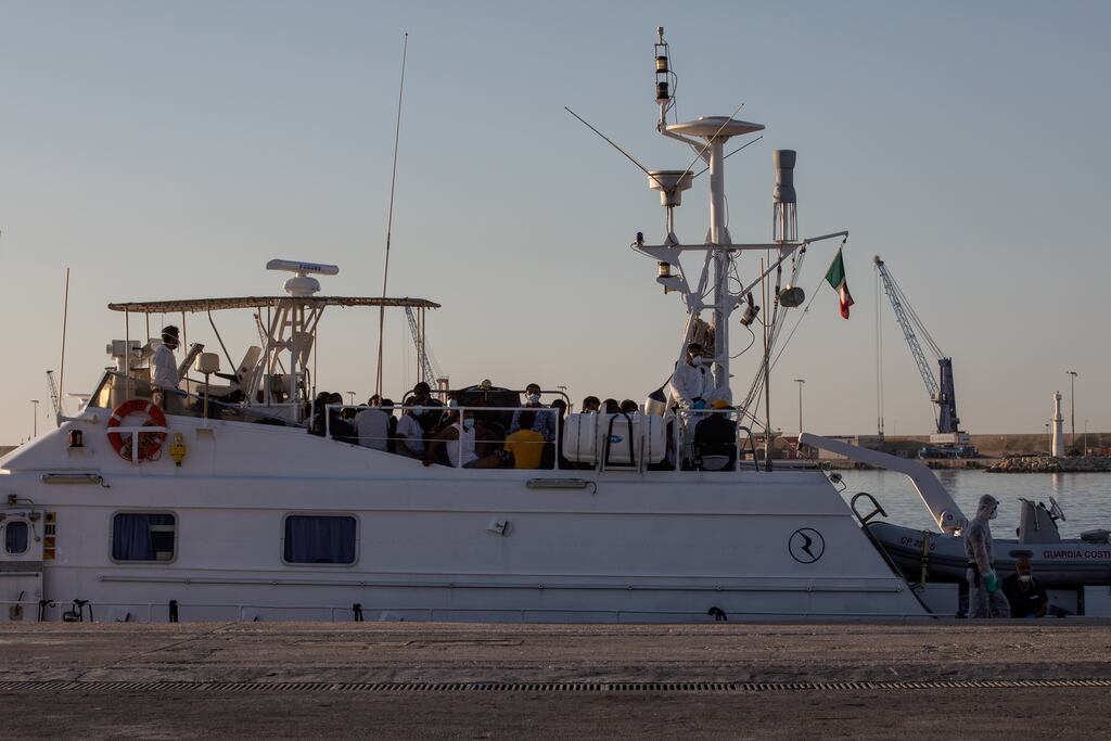FMigrants waiting to disembark from an Italian Coast Guard boat in Sicily. File photograph: Fabio Bucciarelli/The New York Times