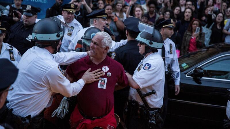 Police detain a protester, part of a large crowd demonstrating over the death of Freddie Gray, near Union Square in New York. Photograph: Michael Appleton/The New York Times