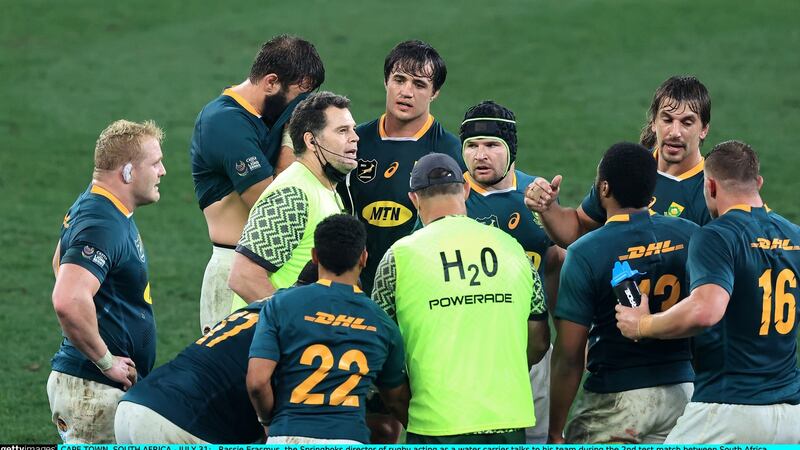 Rassie Erasmus, the Springboks director of rugby acting as a water carrier talks to his team. Photograph: David Rogers/Getty Images