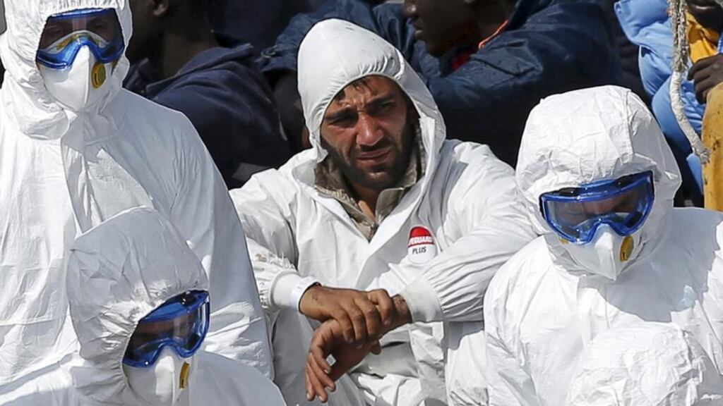 Mohammed Ali Malek, one of two survivors of Saturday’s migrant boat disaster, later arrested on suspicion of people trafficking, is seen watching bodies of dead migrants being disembarked from the Italian coastguard ship Bruno Gregoretti, at Senglea in Valletta’s Grand Harbour. Photograph: Reuters