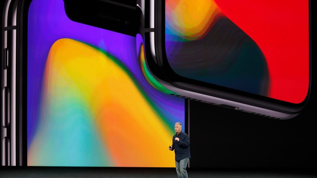 Apple senior vice president of worldwide marketing Phil Schiller introduces the iPhone X during a launch event.