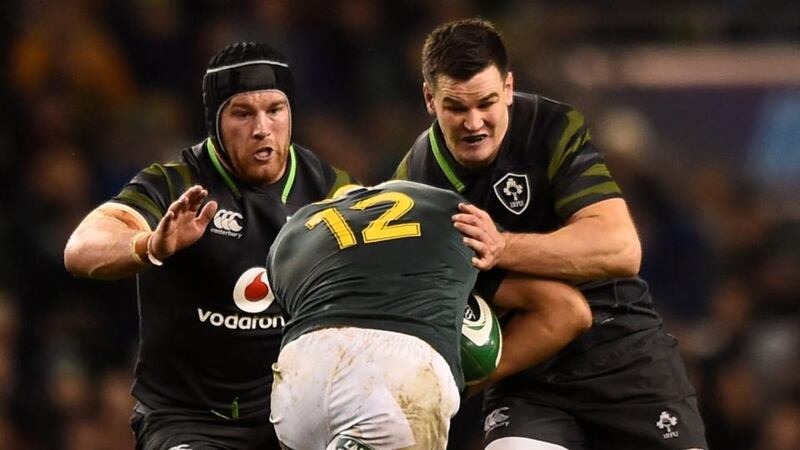 Johnny Sexton and Sean O’Brien wrap up Damian de Allende. Photograph: Clodagh Kilcoyne/Reuters