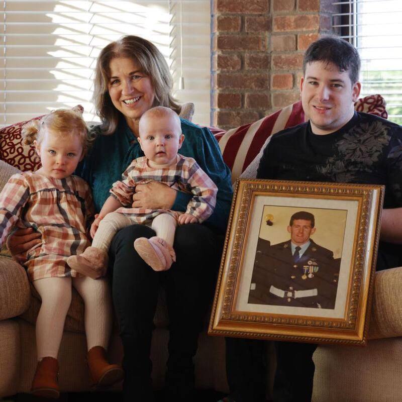 Monica Mooney, widow of Sgt Pat Mooney, with her son Mark and grandchildren Amelia (2) and Sienna (6 months) at her home in Co Meath. Photograph: Alan Betson