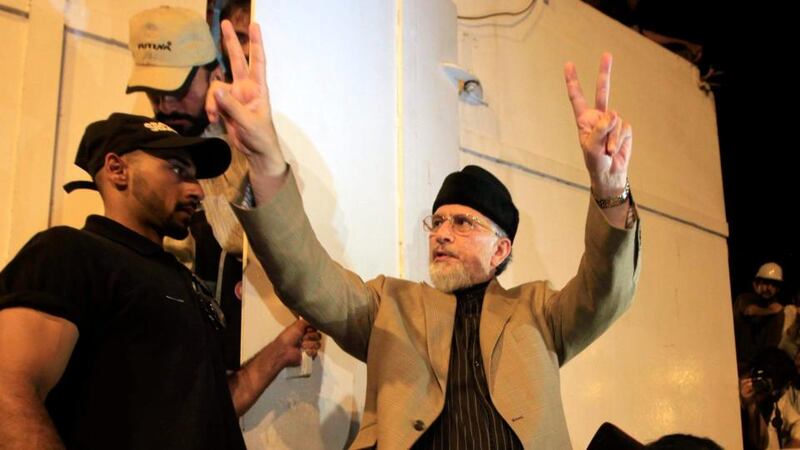 Pakistani-Canadian cleric Tahir ul-Qadri arrives to speak to supporters during a sit-in protest in Islamabad, Pakistan today which sought to prevent MPs from leaving or entering parliament amid concerns over corruption. Photograph: Bilawal Arbab/EPA.