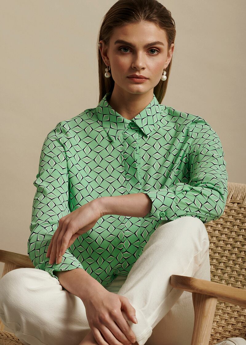 Mint green print shirt, €75, by Tullia, worn with high-waisted jeans, €34.99. Photograph: Alex Hutchinson